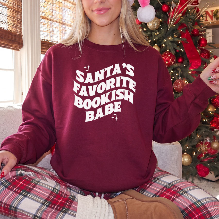 Santa's Favorite Bookish Babe Gildan Crewneck Sweatshirt