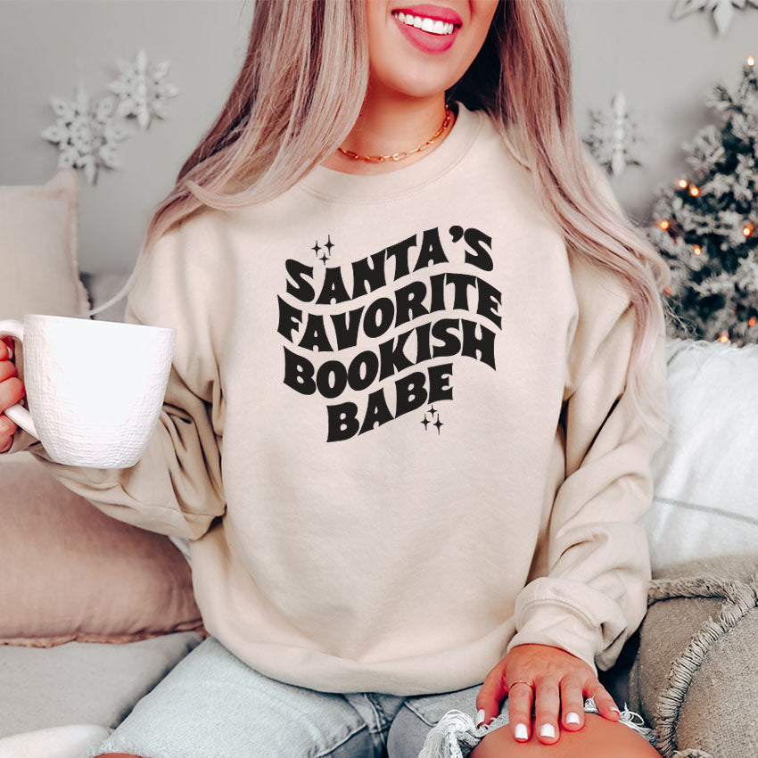 Santa's Favorite Bookish Babe Gildan Crewneck Sweatshirt