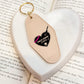 True Crime Junkie Motel Keychain for Mystery and Crime Book Lovers