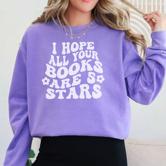 Cozy bookish sweatshirt featuring a bold, retro-style "I Hope All Your Books Are 5 Stars" design. Modeled in various colors, this soft and stylish sweater is perfect for book lovers who enjoy comfy, literary-inspired fashion while reading or lounging.
